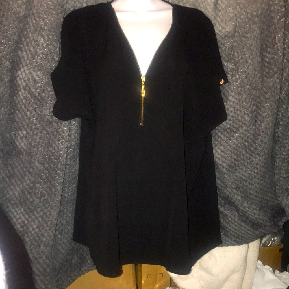 Profile apparel Black blouse with gold hardware.